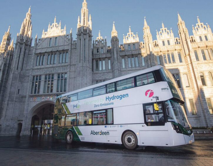 hydrogen double-decker bus parked in front of Marischal College in Aberdeen city