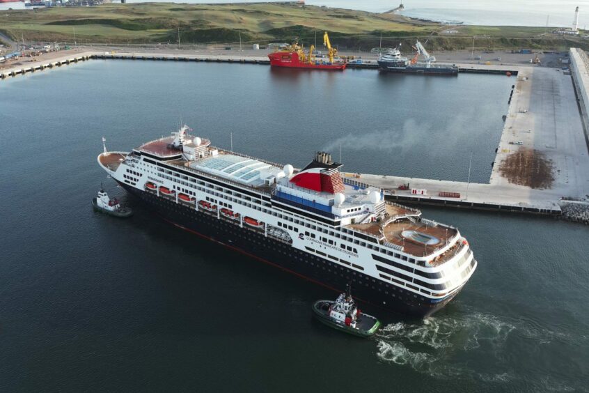 a cruise ship passes through the Port of Aberdeen