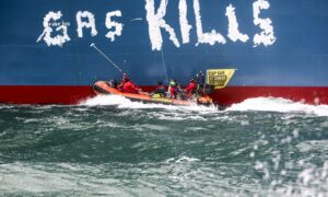 Greenpeace activists have tagged an FSRU arriving at Le Havre