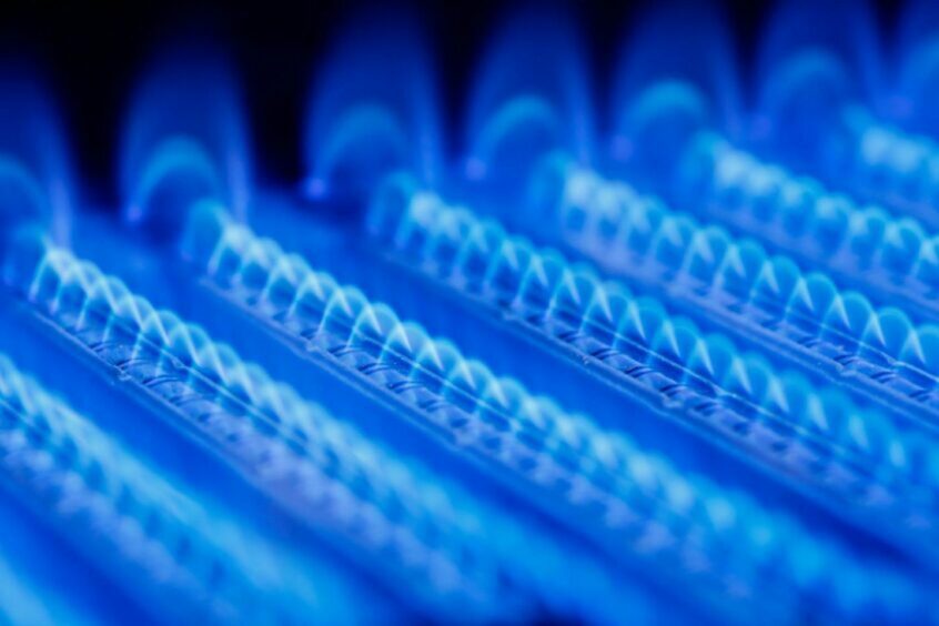 The blue flames inside a gas boiler