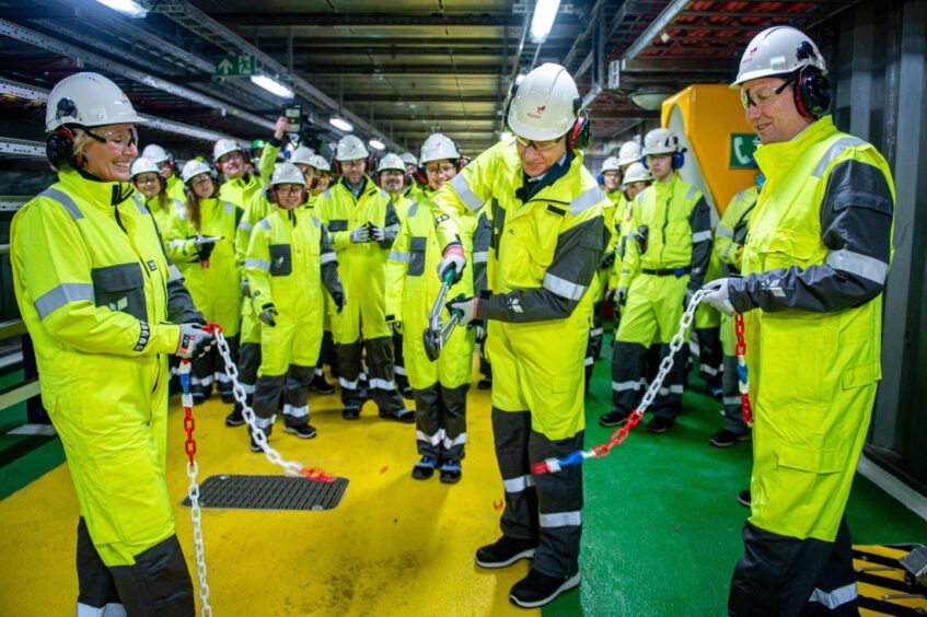 Terje Aasland, center, during a ceremony at Equinor's Johan Sverdrup offshore oil drilling platform.