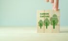 Blocks with carbon capture storage and three trees painted on them.