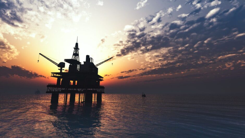 North Sea oil rig in silhouette.