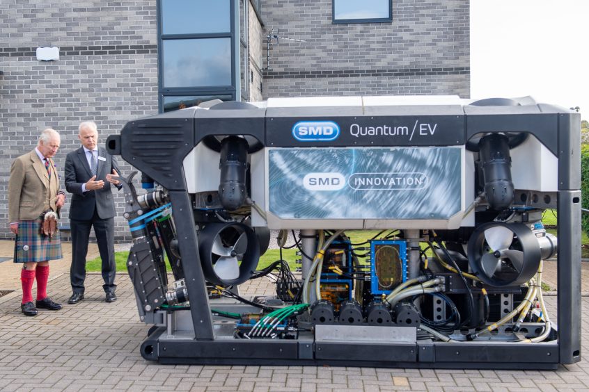 King Charles inspected a ROV outside with Mike Jones, chairman of the GUH North Advisory Group. Image: Kami Thomson/DC Thomson.