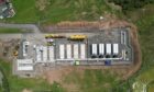 Aerial shot of Tesla megapacks arriving at Little Raith BESS in Fife.