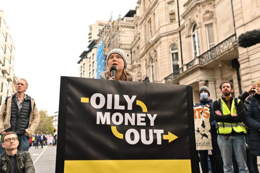 Greta Thunberg addresses protestors and crowds at the Energy Intelligence Forum.