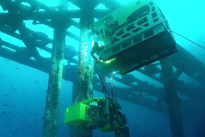 A DeepOcean remotely operated vehicle conducts decommissioning works on the Dunlin Alpha platform.