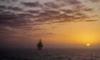 Oil platform at sunset in the North Sea.