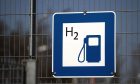 A chemical symbol on a hydrogen fuel pump sign at a railway train refuelling station in Salzgitter, Germany, on Tuesday, April 20, 2021.