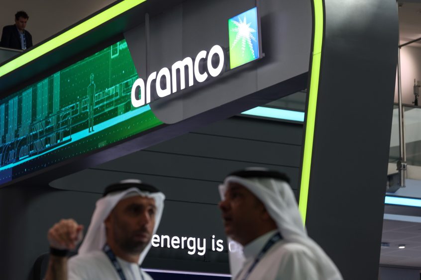 Signage above the Saudi Aramco booth on day two of the Abu Dhabi International Petroleum Exhibition and Conference (ADIPEC) in Abu Dhabi, United Arab Emirates, on Tuesday, Oct. 3, 2023.