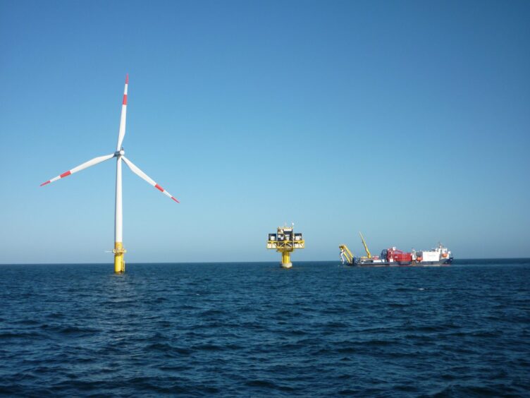 Offshore wind tubine, substation and cable vessel.