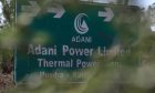 Signage of the Mundra Thermal Power Plant of Adani Power Ltd., sit on displayed in Mundra, Gujarat, India, on Thursday, Feb. 9, 2023.