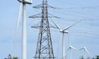 Wind turbines and electricity pylons carrying their electricity on the Causeymire in Caithness.