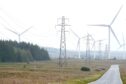 Wind turbines and electricity pylons on the Causeymire in Caithness.