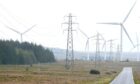 Wind turbines and electricity pylons on the Causeymire in Caithness.