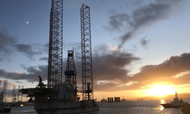 ADES Shelf acquisition under way in deal expected to close this year. Sunset over a rig.
