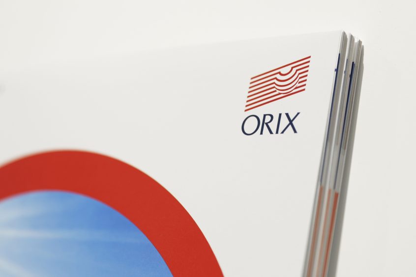 The Orix Corp. logo displayed on a brochure at the companys headquarters in Tokyo, Japan, on Tuesday, Oct. 19, 2021.  Photographer: Kiyoshi Ota/Bloomberg