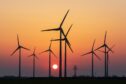 Onshore wind farm with sunset in background