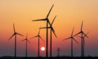 Onshore wind farm with sunset in background