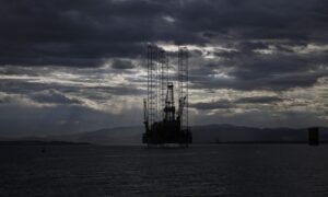 Clouds gather above an offshore drilling rig anchored in the U.K. Photographer: Bloomberg Creative Photos/Bloomberg
