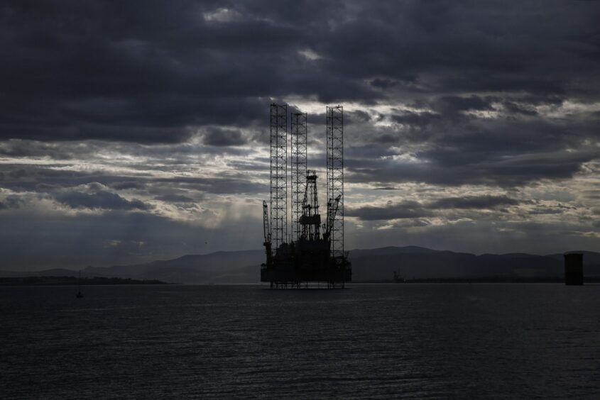 Clouds gather above an offshore drilling rig anchored in the U.K. Photographer: Bloomberg Creative Photos/Bloomberg