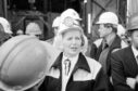 The Prime Minister, Margaret Thatcher, in white overalls, a miners helmet and donkey jacket for her trip down a mine shaft at the Wistow colliery in the Selby coalfield.