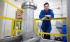 Charles Cai and a pioneering 20-gallon "reactor" for the production of low cost, sustainable biodiesel.