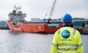 An ASCO worker standing on the quayside in Aberdeen.