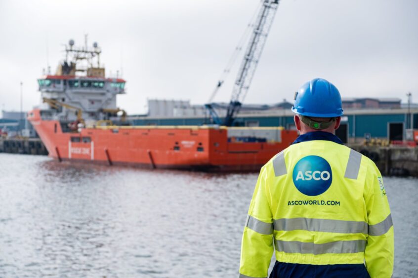 An ASCO worker standing on the quayside in Aberdeen.