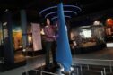 Curator Ellie Swinbank installs the Nova tidal turbine blade at the National Museum of Scotland in Edinburgh.