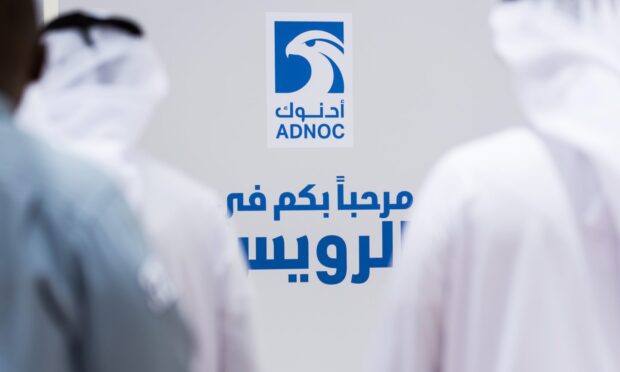 Officials arrive for a tour of the Ruwais refinery and petrochemical complex, operated by Abu Dhabi National Oil Co. (ADNOC), in Al Ruwais, United Arab Emirates, on Monday, May 14, 2018. Adnocis seeking to create worlds largest integrated refinery and petrochemical complex at Ruwais. Photographer: Christophe Viseux/Bloomberg via Getty Images