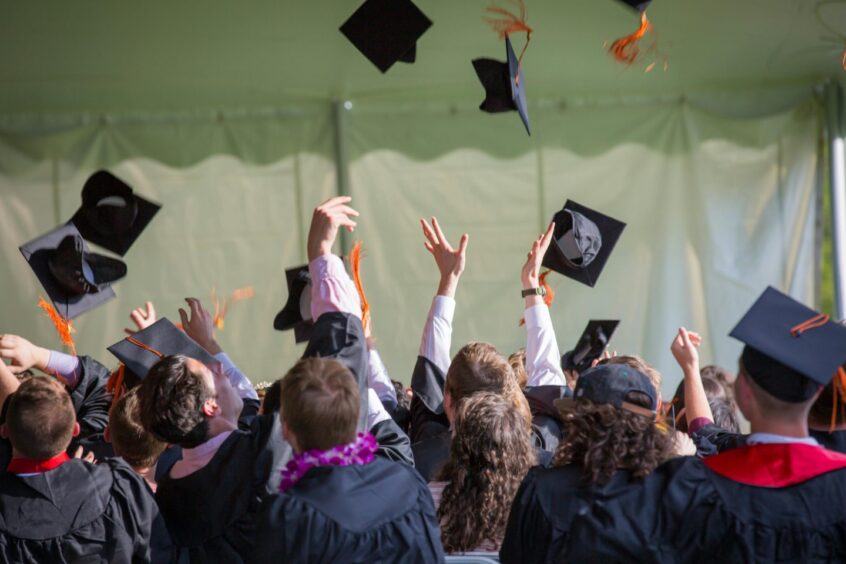 Stock image of people graduating university.