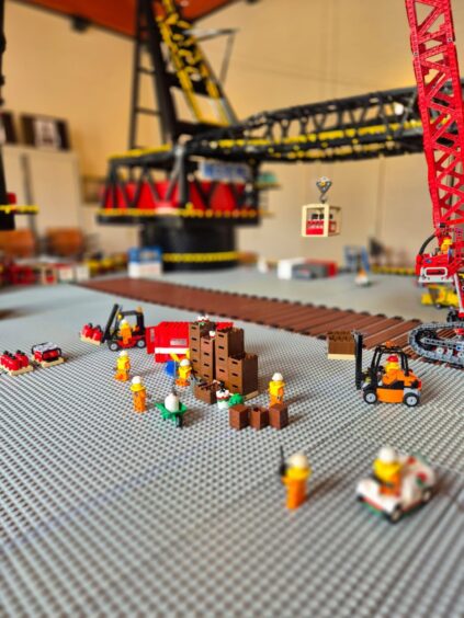 Minifigures hard at work on the deck of the Lego Thialf vessel.