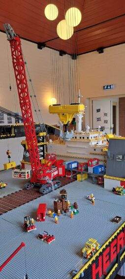 Lego men on the deck of the Thialf vessel recreation