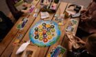 In Catan: New Energies, players must decide between fossil fuels and clean energy.