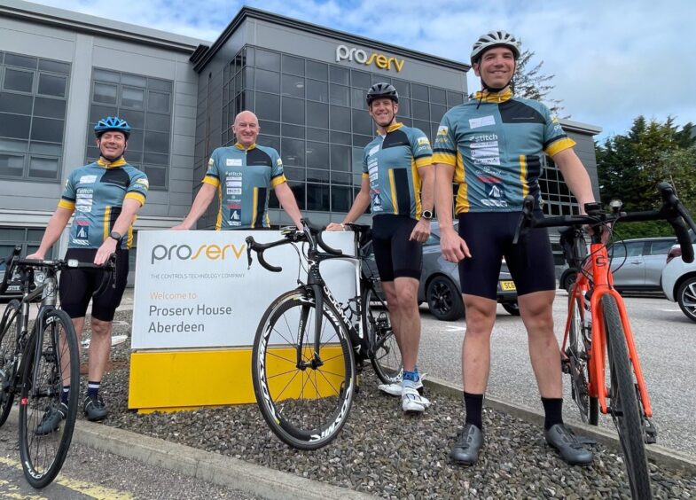 Some of Proserv's cyclists in Aberdeen - Davis Larssen (second left) and Bradley Savoldelli (right)