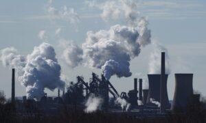 Emissions from chimneys at the British Steel Ltd. plant in Scunthorpe, UK, on Monday, March, 27, 2023. British Steel has proposed closing its coke ovens in a bid to overcome global economic challenges and build a green and sustainable future. Photographer: Dominic Lipsinski/Bloomberg