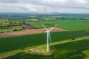 A wind turbine in a field near the Drax Power Station, operated by Drax Group Plc, near Selby, UK. Photographer: Dominic Lipinski/Bloomberg