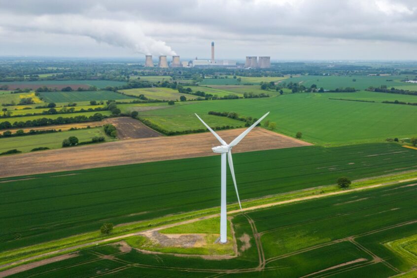 A wind turbine in a field near the Drax Power Station, operated by Drax Group Plc, near Selby, UK, on Tuesday, May 21, 2024. Photographer: Dominic Lipinski/Bloomberg