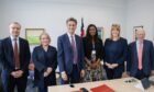 Labour frontbench energy team including Ed Miliband and Sarah Jones.