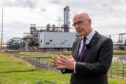 First Minister John Swinney visiting the site of the Acorn Scottish Cluster carbon transport and storage terminal to announce Scottish Government support for the project on 22 July, 2024.