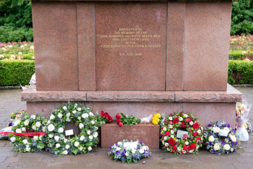 Flowers were laid at the foot of the statue by industry and  loved ones.