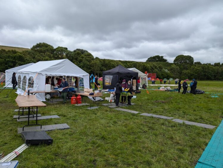 Tents and community spaces being set up at Climate Camp Scotland in Aberdeen.