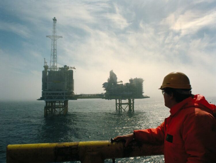 A worker looks out at BP's ETAP platform in the North Sea.