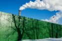 Chimneys emit vapor behind a perimeter fence with tree shadows at the Segezha Pulp and Paper Mill JSC, operated by Segezha Group, in Segezha, Russia, on Friday, March 19, 2021.