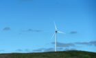 A wind turbine on a hill