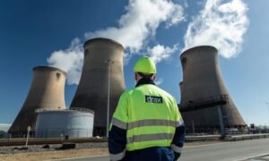 A Drax employee stands outside the Drax Power Station in Yorkshire.