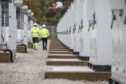 EDF Renewables employees at a battery energy storage facility.