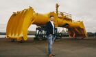 Mocean Energy founder and managing director Cameron McNatt in front of the company's BlueX wave energy converter.