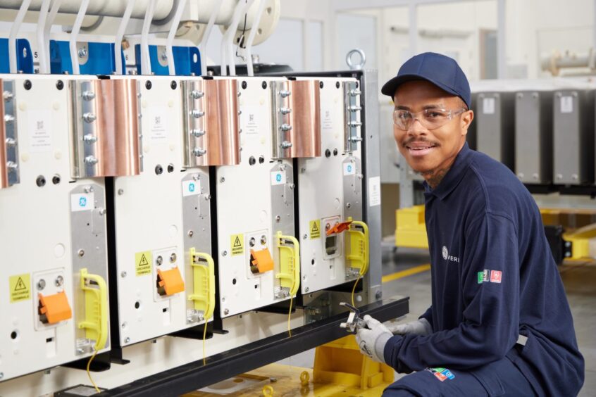 Worker at GE Vernova electrification systems? grid solutions business in Stafford.